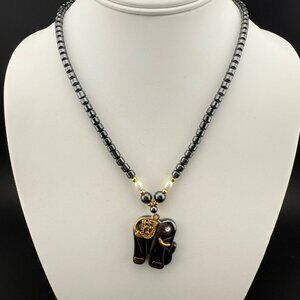 Black Hematite Beaded Elephant Necklace With Gold Tone Accents & Pearl Detailing